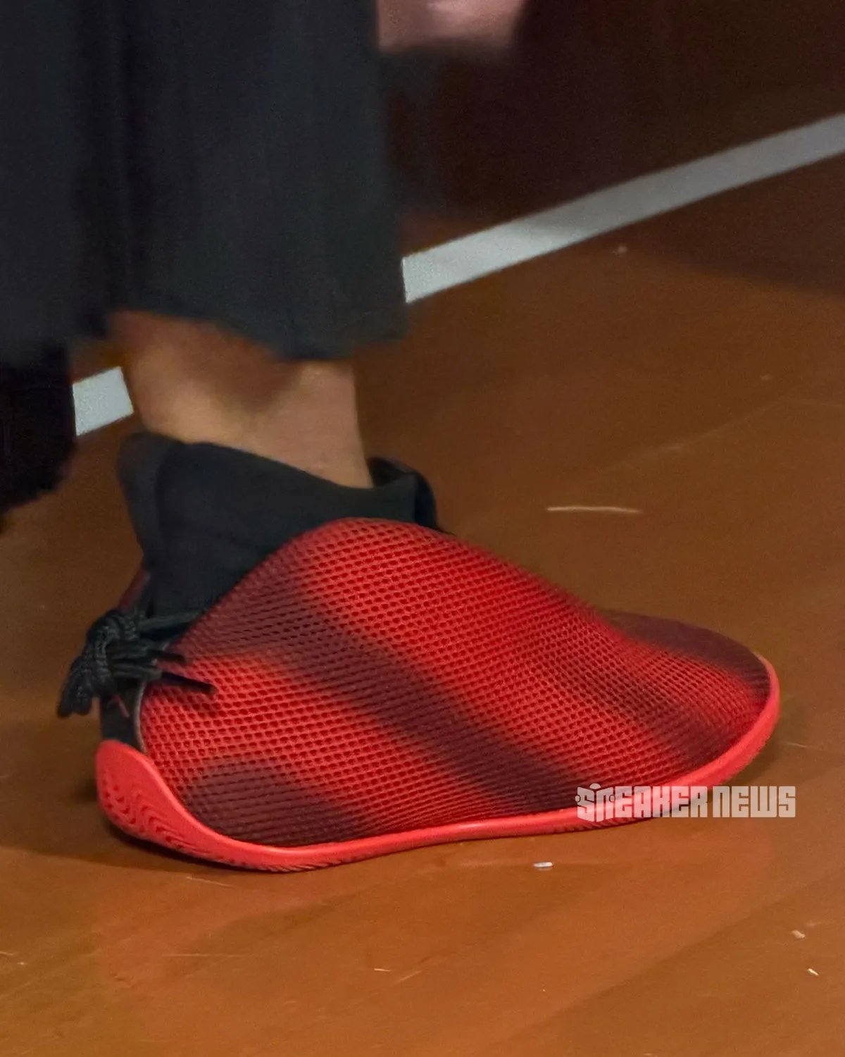 Jordan Vail lifestyle sneaker in red and black, showcasing mesh upper and unconventional rear-wrapping lace system - detail view 3
