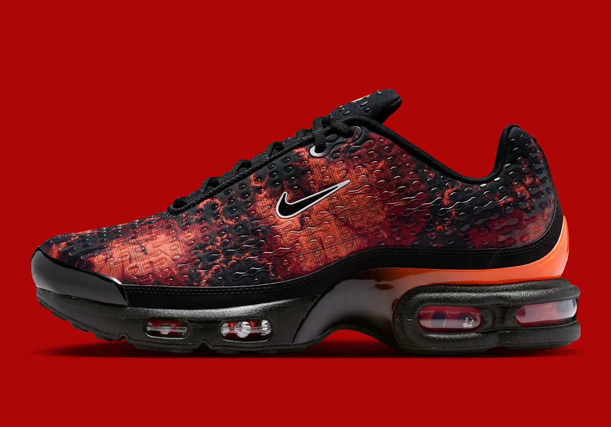 Nike Air Max Plus VII Fire Red featuring black base with Fire Red and Hyper Crimson patterning and translucent TPU overlays - detail view 1
