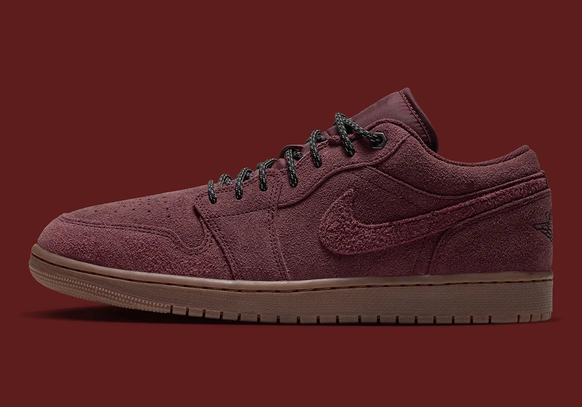 Nike Air Jordan 1 Low 'Dark Team Red' featuring shaggy suede, two-tone boot laces, and gum rubber sole in autumn colorway - detail view 1