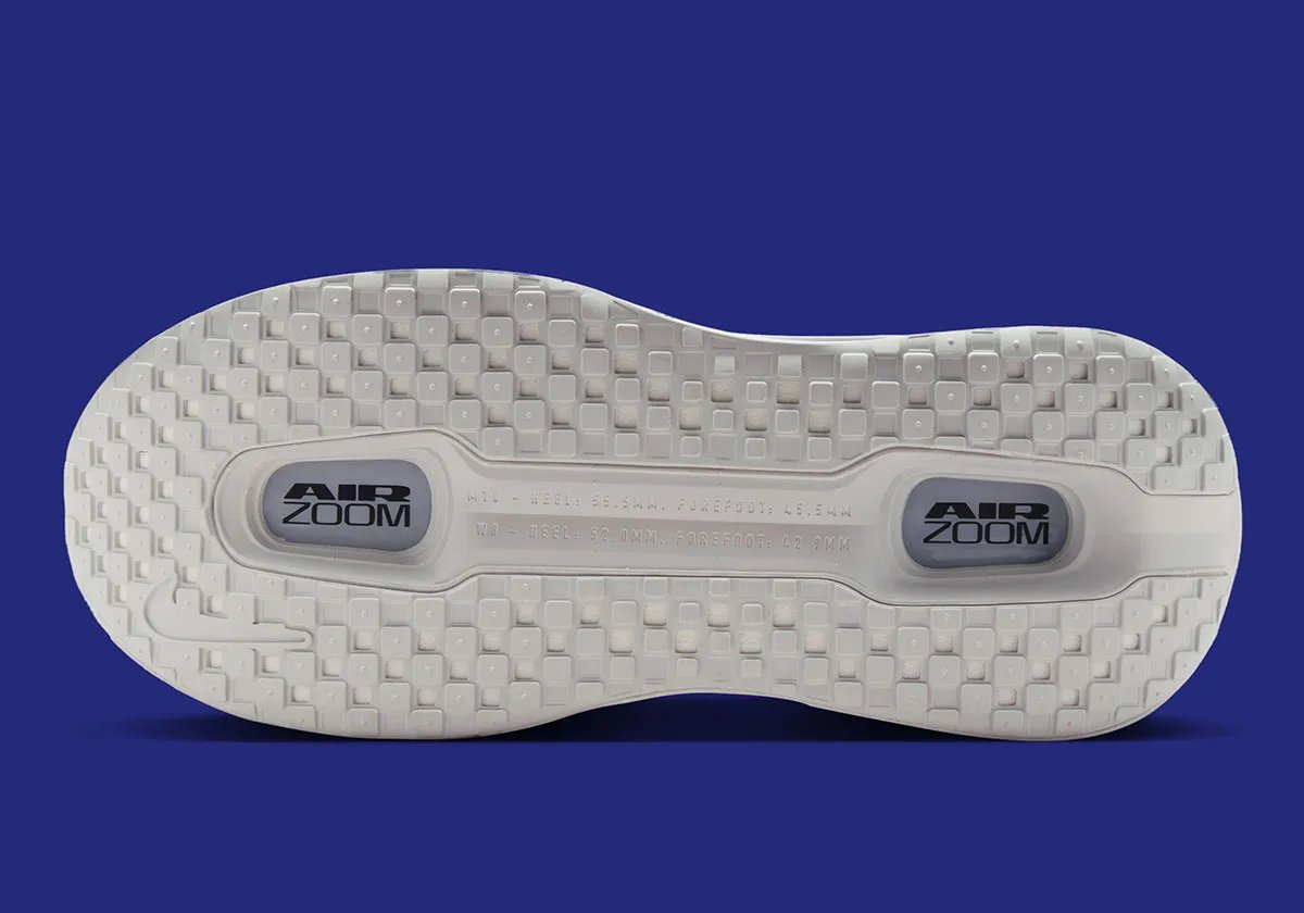 Nike Vomero Premium in Off White colorway with Dark Obsidian Swoosh, lateral view showing 55mm cushioning stack - detail view 2