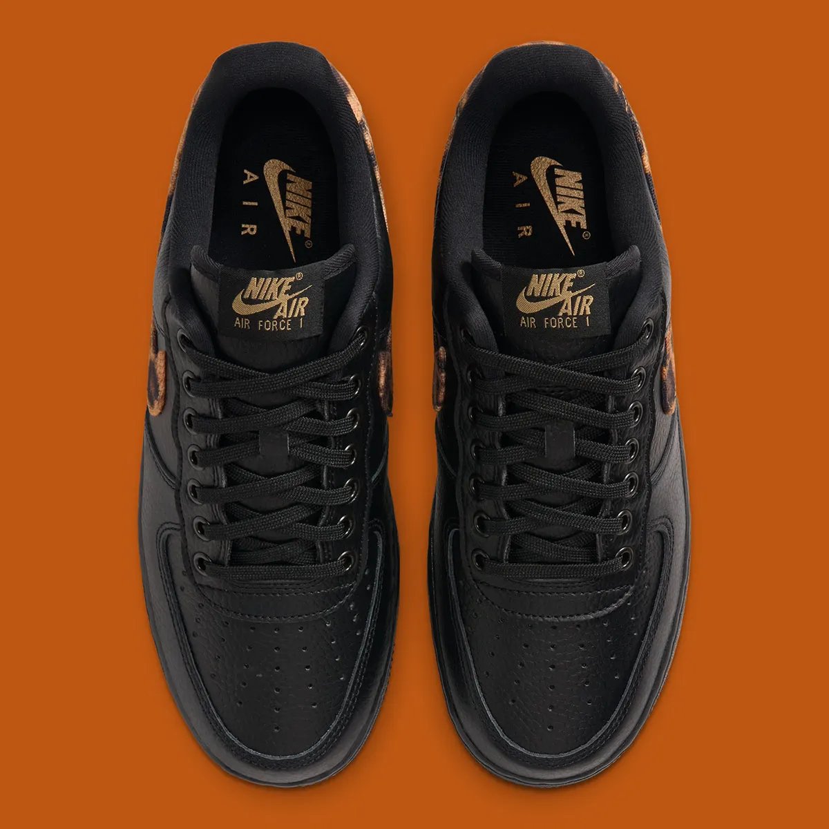 Nike Air Force 1 Low in black tumbled leather with leopard print detailing on the Swoosh and heel tab - detail view 3