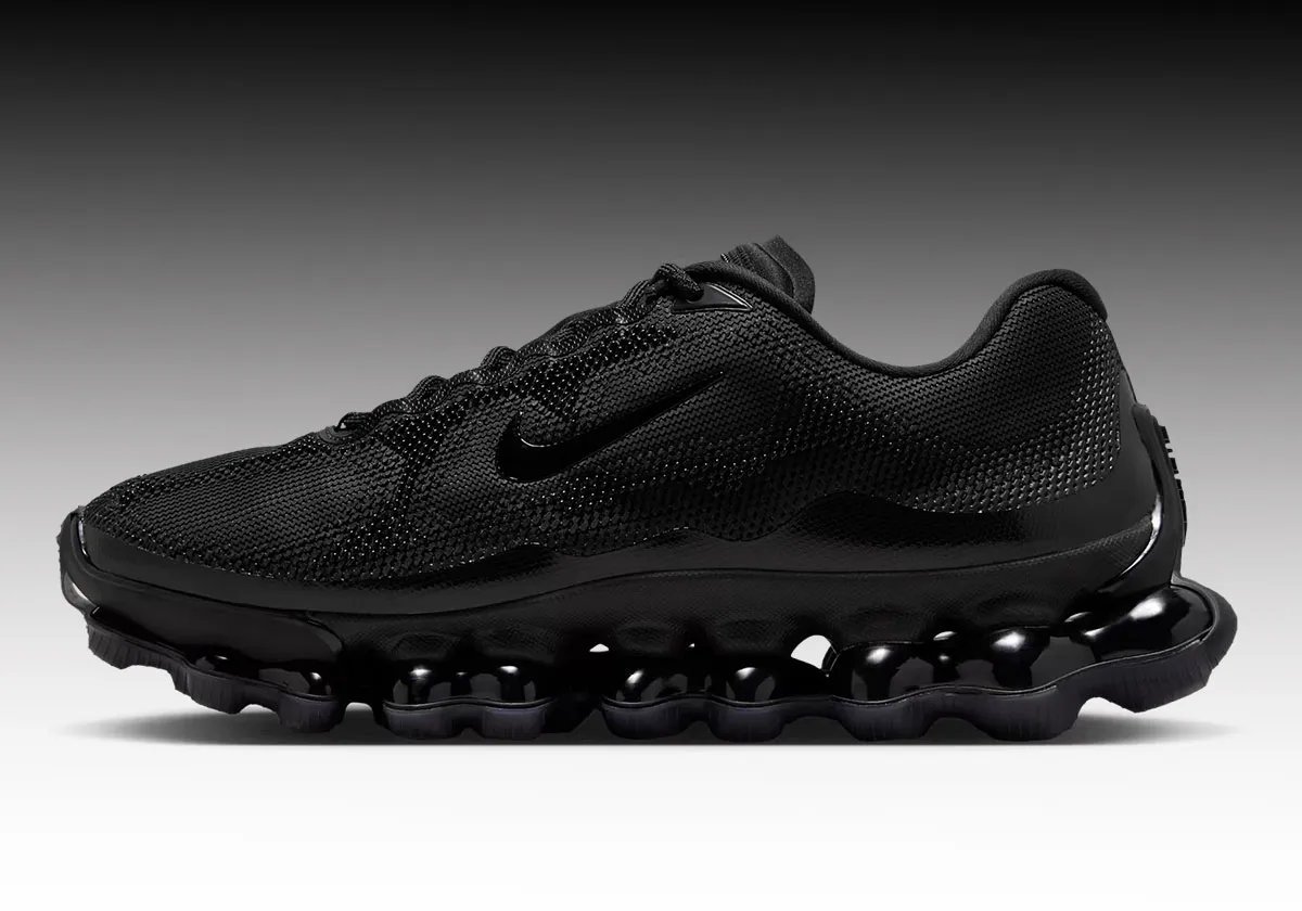 Nike Air Liquid Max Triple Black sneaker with minimal design and dot matrix midsole pattern - detail view 1